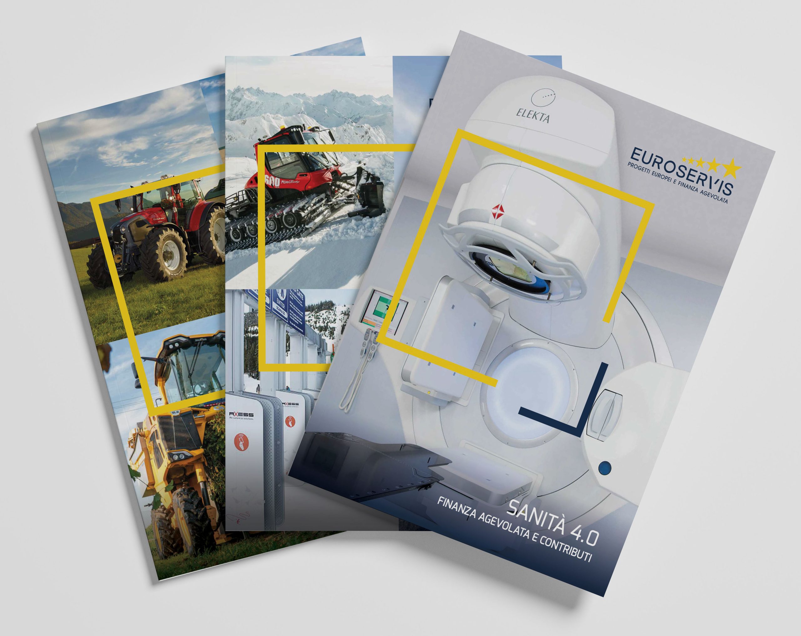 Diversi opuscoli sono disposti a ventaglio su una superficie piana. La brochure in alto mostra una macchina per risonanza magnetica con il titolo "SANITA 4.0" e loghi tra cui "EURO SERVIS" in alto. Le brochure sottostanti raffigurano macchine agricole in paesaggi montani.